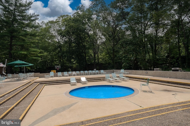 community pool featuring a patio area