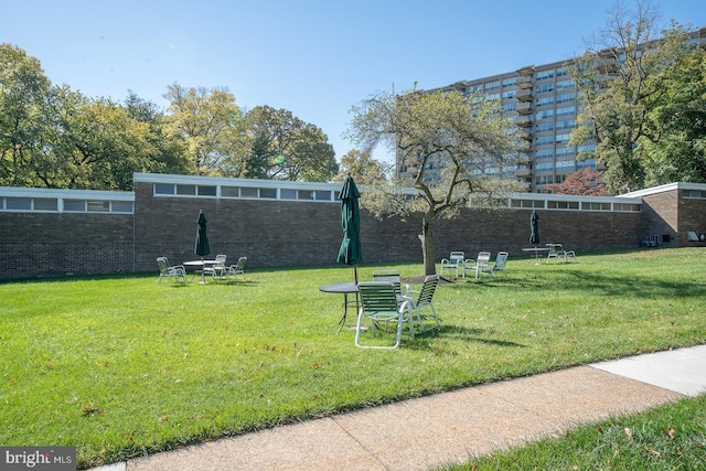 view of home's community featuring a lawn