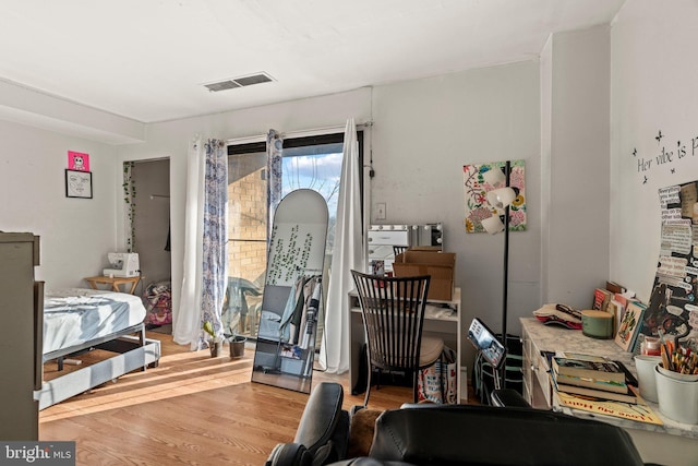 bedroom with light hardwood / wood-style flooring