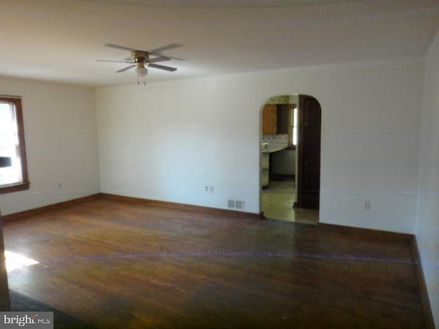 spare room with hardwood / wood-style flooring and ceiling fan