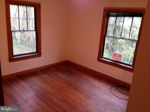 empty room featuring hardwood / wood-style flooring