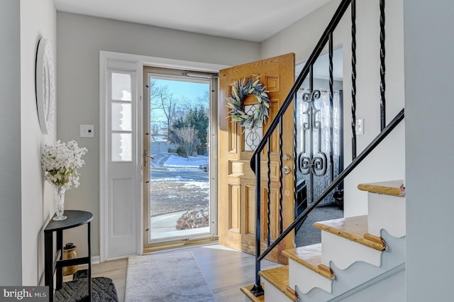 foyer entrance featuring hardwood / wood-style floors