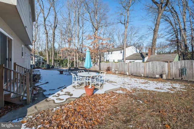 view of yard layered in snow