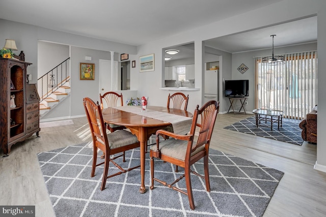 dining area with light hardwood / wood-style flooring