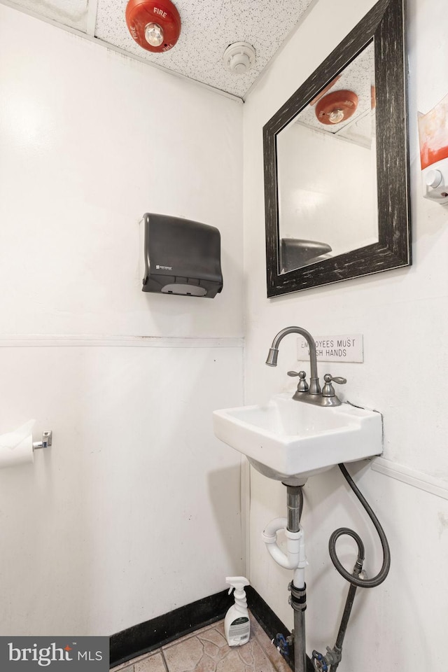 bathroom with tile patterned flooring and sink