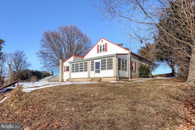 view of property exterior featuring a lawn