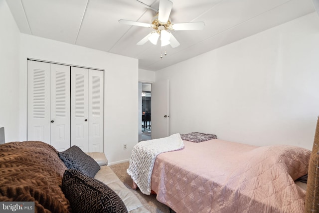 bedroom with carpet flooring, ceiling fan, and a closet