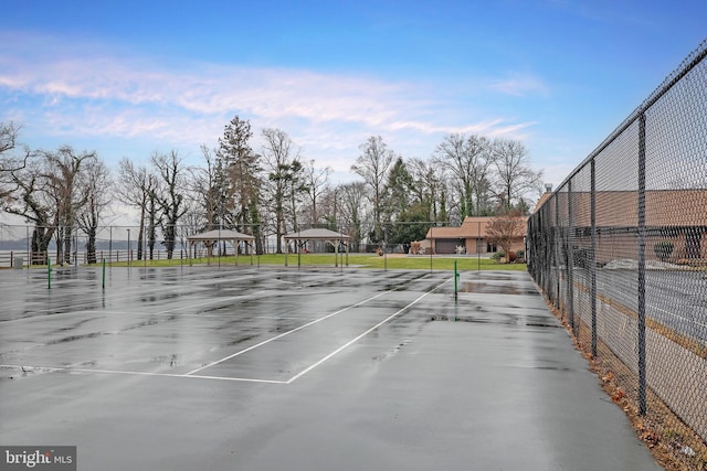 view of tennis court with a gazebo