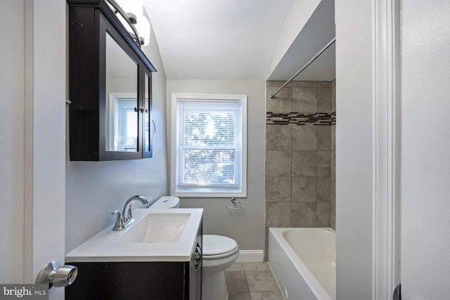 bathroom with tile patterned flooring, toilet, bathing tub / shower combination, vanity, and baseboards