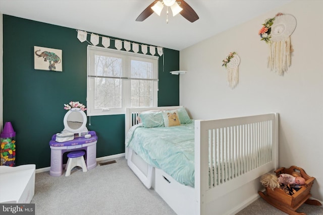 bedroom featuring visible vents, ceiling fan, light carpet, and baseboards