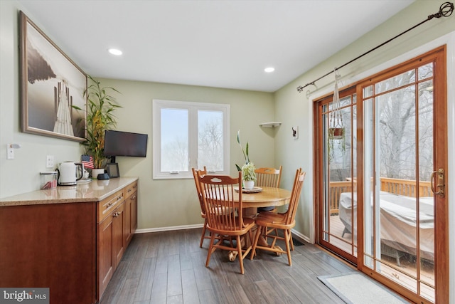 dining room featuring recessed lighting, baseboards, and wood finished floors