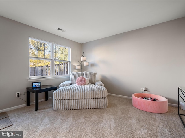 bedroom featuring light colored carpet