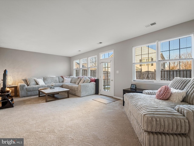 living room featuring light colored carpet