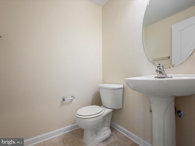 bathroom featuring toilet and sink