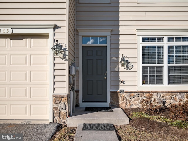 property entrance with a garage