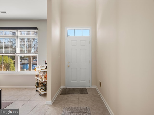 foyer entrance featuring light tile patterned floors