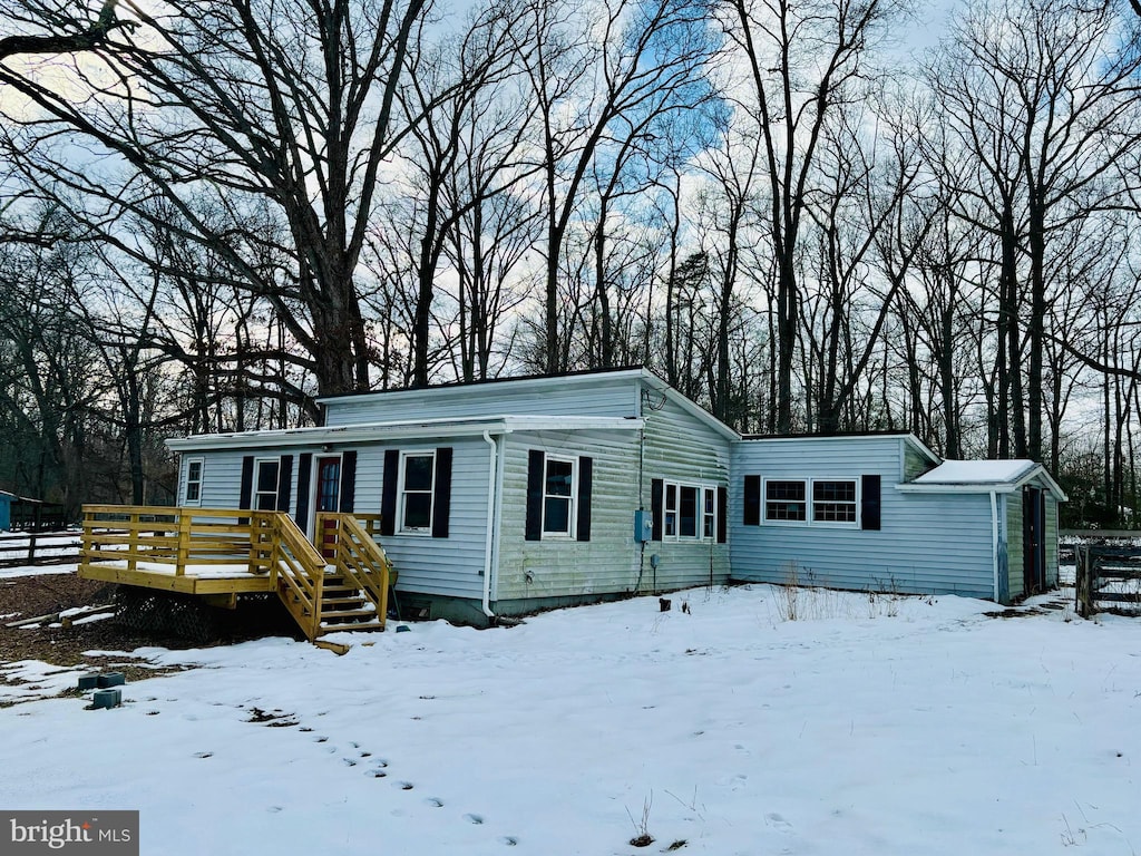 view of front of home with a wooden deck