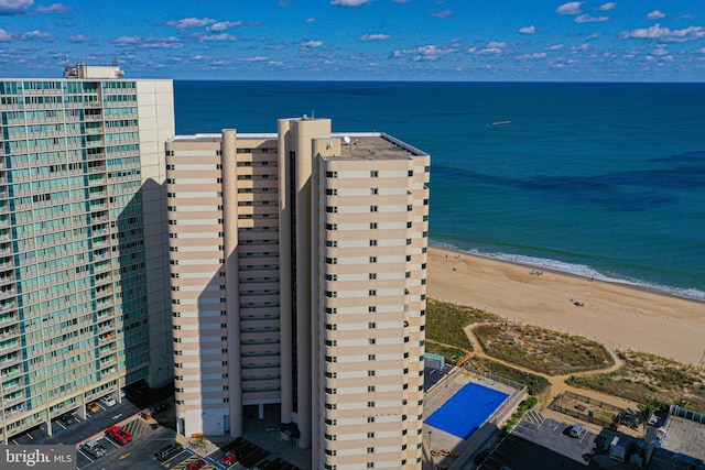 aerial view featuring a water view and a beach view