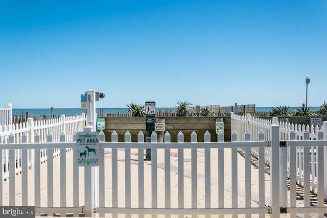 view of gate featuring a water view