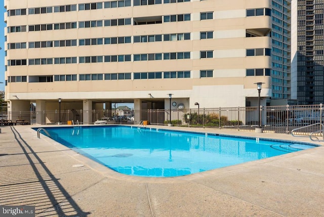 view of pool featuring a patio area