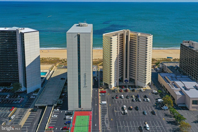 aerial view featuring a water view and a view of the beach