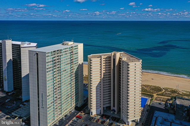 aerial view featuring a view of the beach and a water view