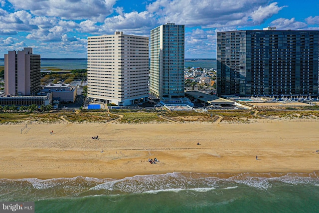 aerial view featuring a water view and a beach view