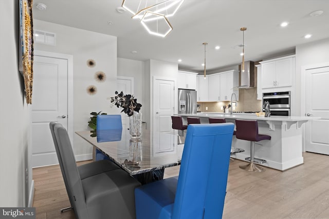 dining area with light hardwood / wood-style flooring