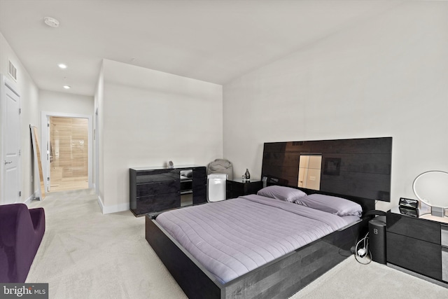 bedroom featuring light carpet and vaulted ceiling