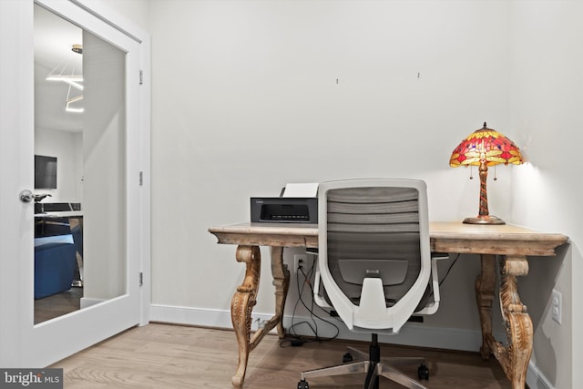 office with wood-type flooring