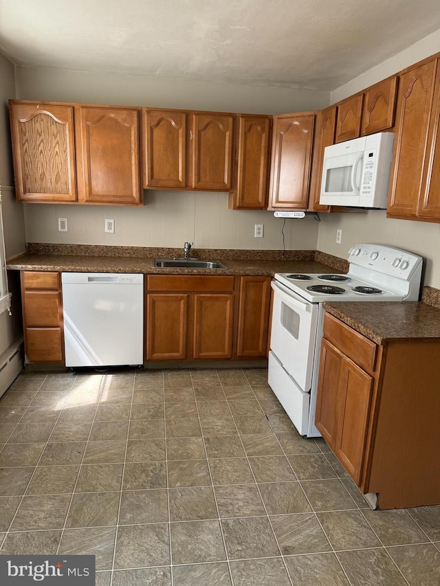 kitchen with sink and white appliances