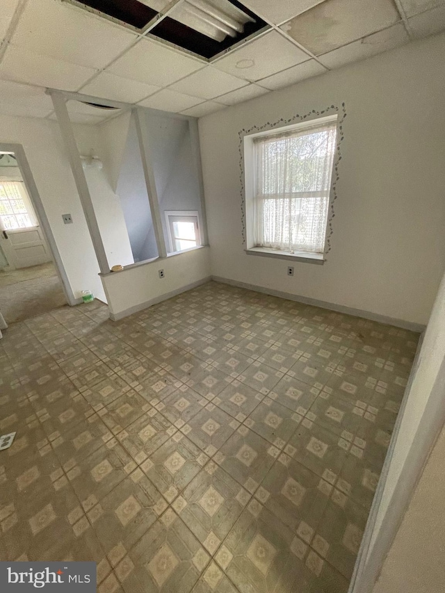 empty room with a paneled ceiling