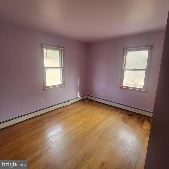 unfurnished room with light wood finished floors