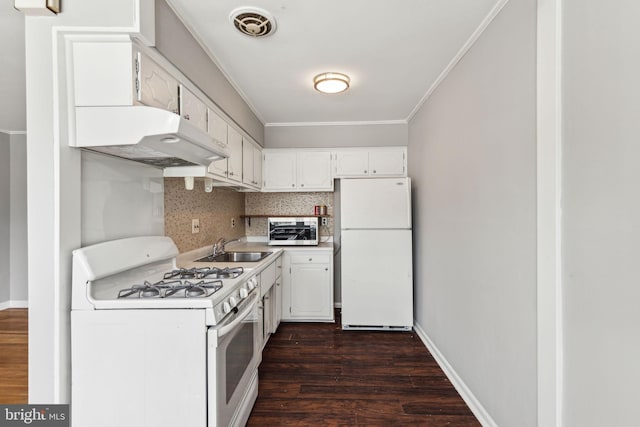 kitchen with white cabinetry, light countertops, dark wood-type flooring, under cabinet range hood, and white appliances