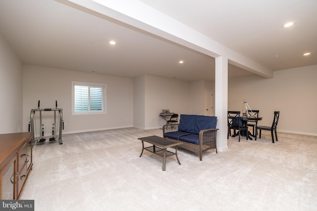 sitting room featuring light carpet