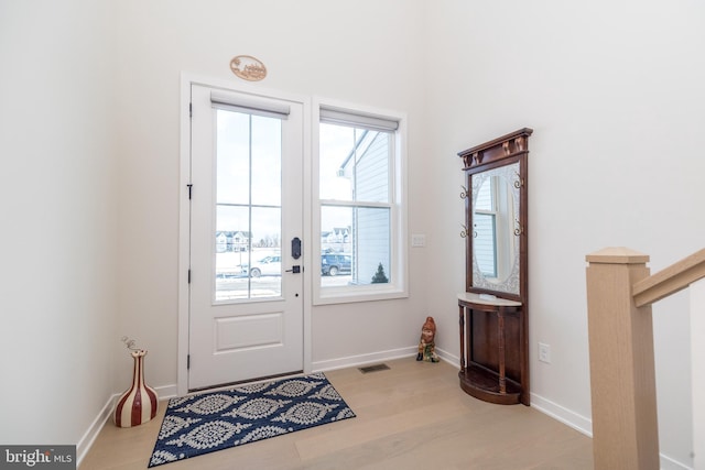 doorway to outside featuring french doors and light hardwood / wood-style floors