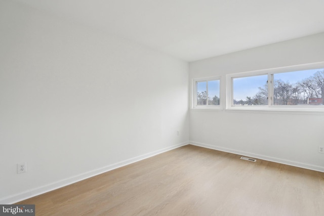 empty room with light wood-type flooring