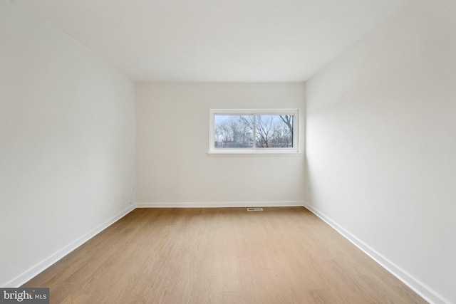 empty room with light hardwood / wood-style floors