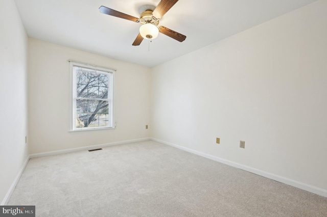 unfurnished room with light carpet and ceiling fan