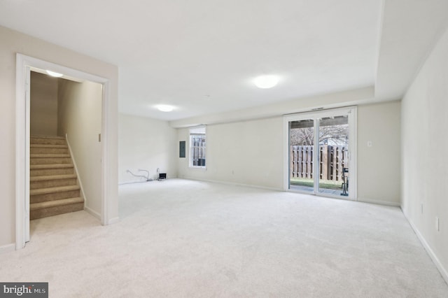 basement with light colored carpet and a healthy amount of sunlight