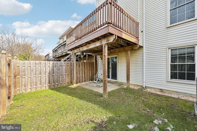 rear view of house featuring a yard and a patio area