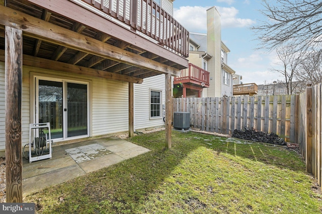 view of yard with cooling unit and a patio