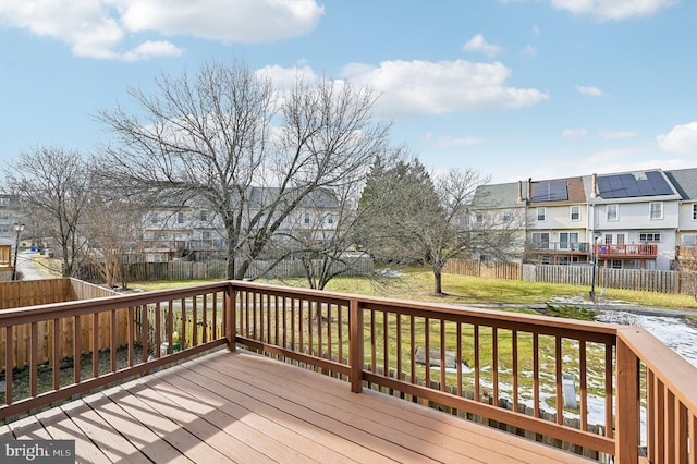 wooden terrace with a lawn