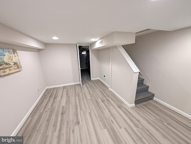 basement featuring light hardwood / wood-style floors