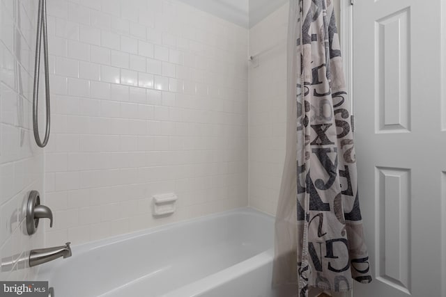 bathroom with shower / bathtub combination with curtain