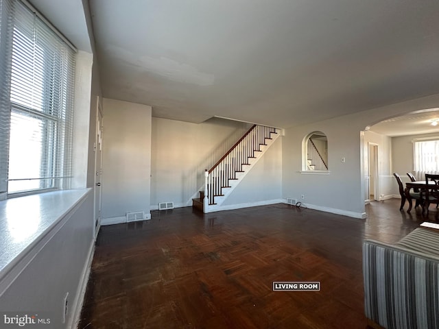 spare room featuring dark parquet floors