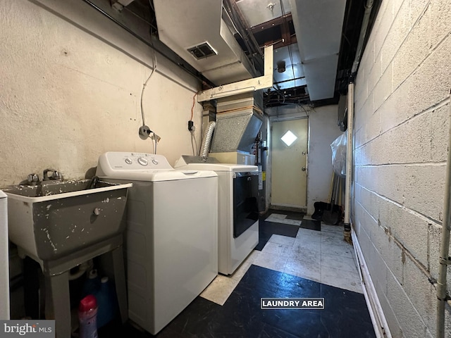 laundry room featuring sink and independent washer and dryer