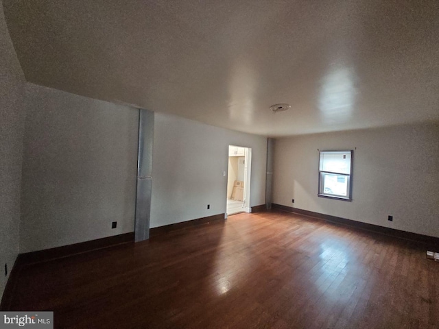 unfurnished room with hardwood / wood-style floors