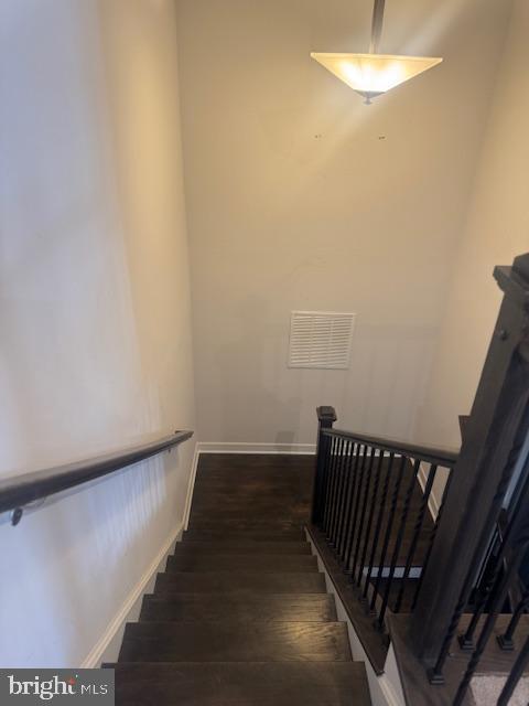 staircase featuring hardwood / wood-style flooring