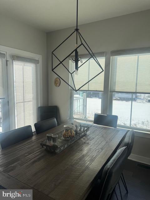 dining space featuring a chandelier